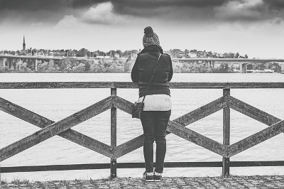 Woman standing on a bridge