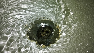 Water flowing down a plughole