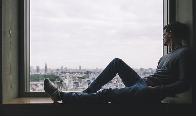 Man sitting in window