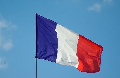 French flag against a blue sky