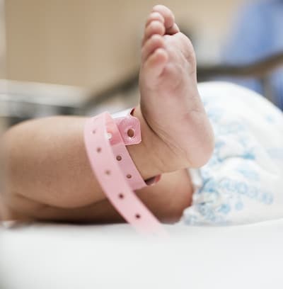 Baby's foot with hospital ID tag