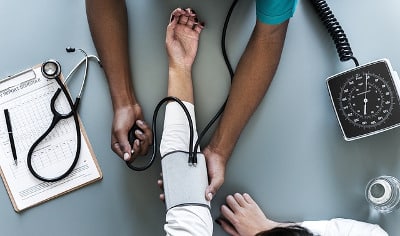 Doctor testing blood pressure