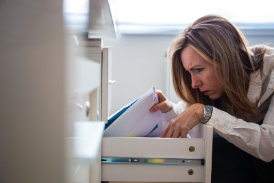 Woman searching for documents