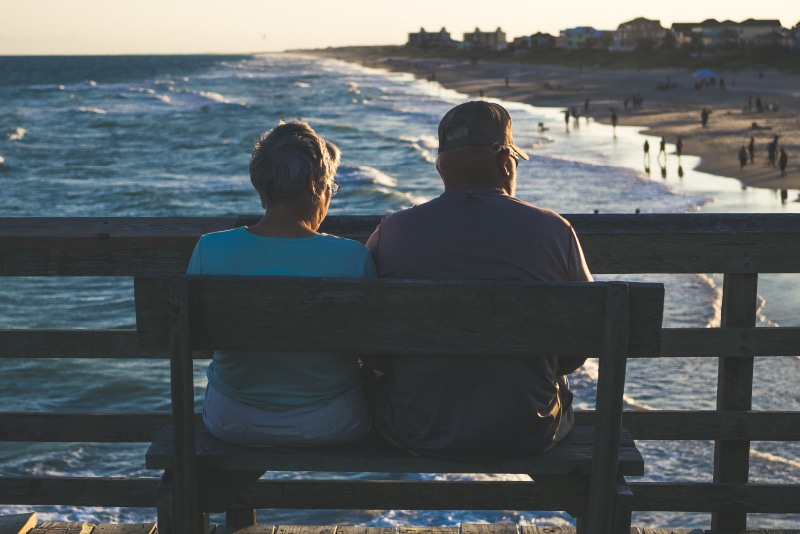 Retirement couple sitting on a bench