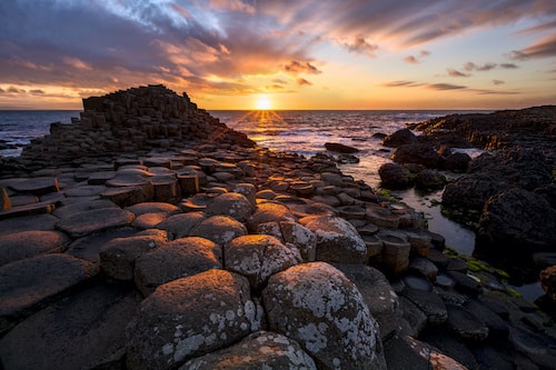 Sunset over rocks on a beach